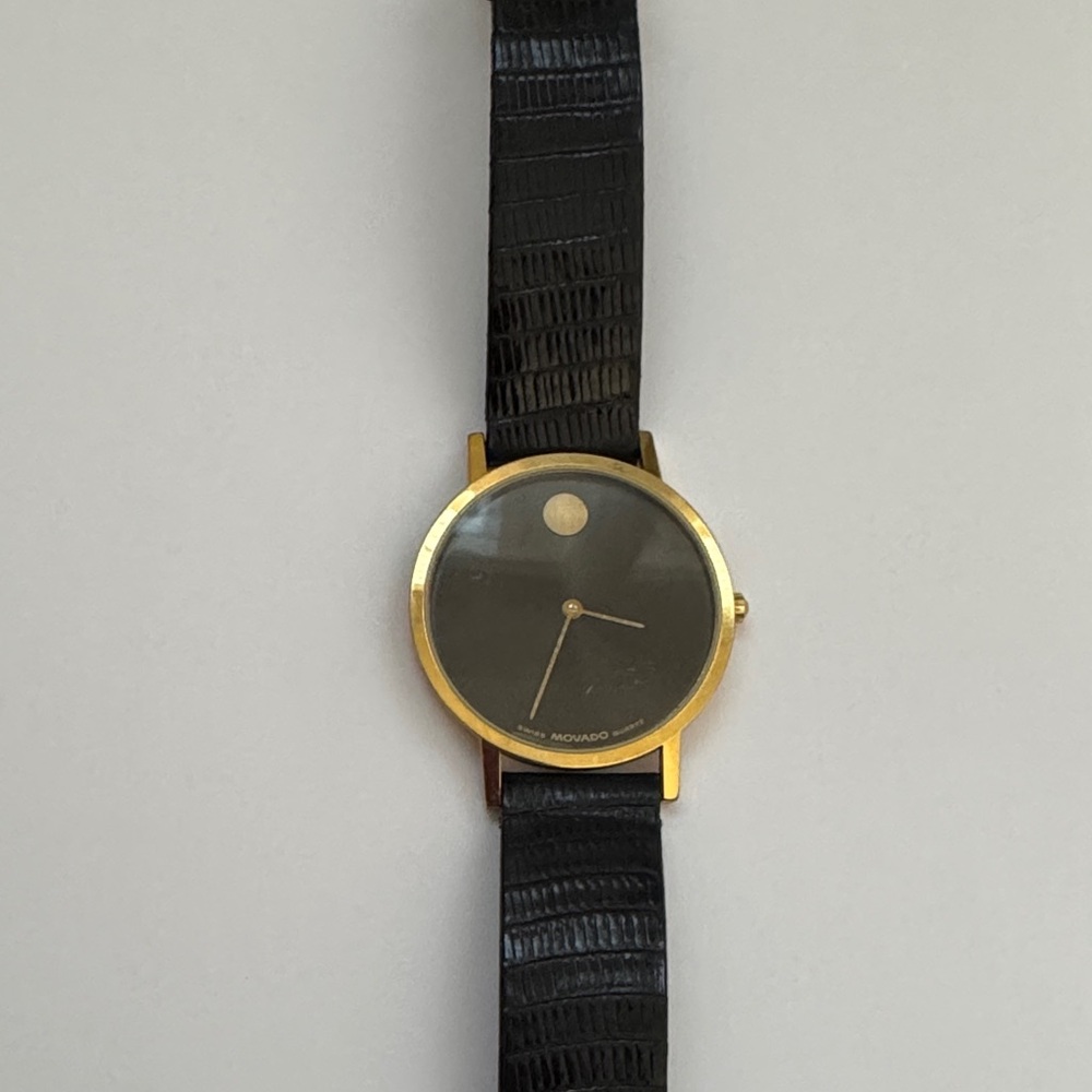 Movado men’s museum watch  with black strap.